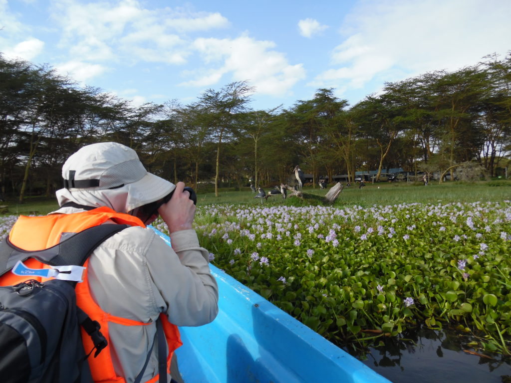 Photographing Maribou Storks from boat on Lake Naivasha, Kenya